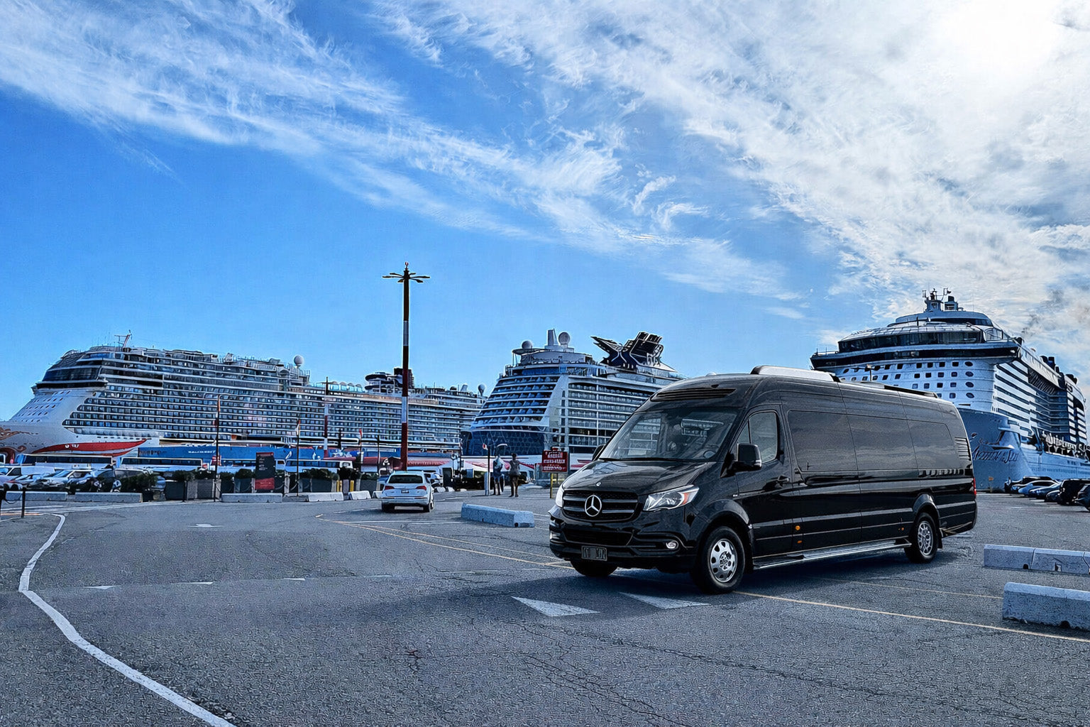 Black van parked in a parking lot with cruise ships in the background